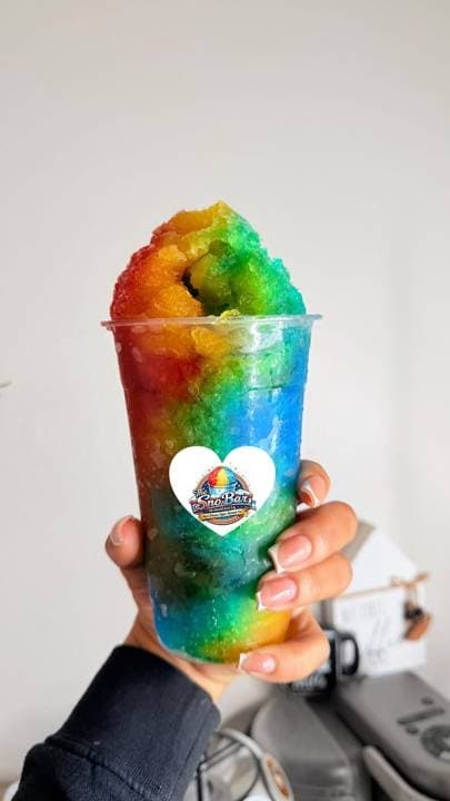 A rainbow snoball from The Sno Bar, piled high above the cup
